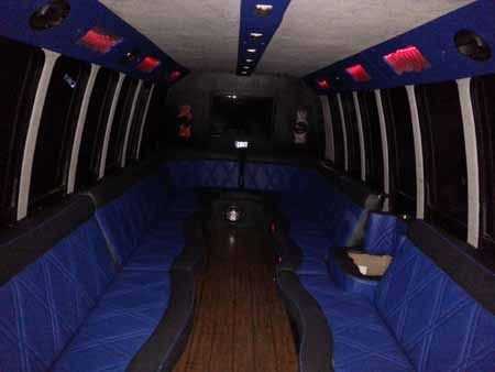 Rental party bus has colored lights inside.