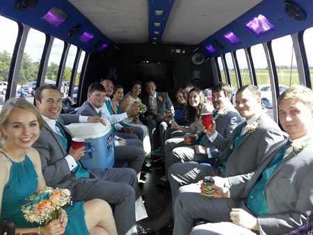 Wentzville wedding party traveling in style on the limo bus
