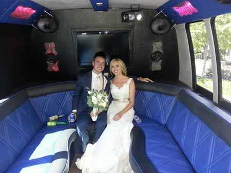 Bride and groom on the limo bus after their wedding in Defiance, Missouri.