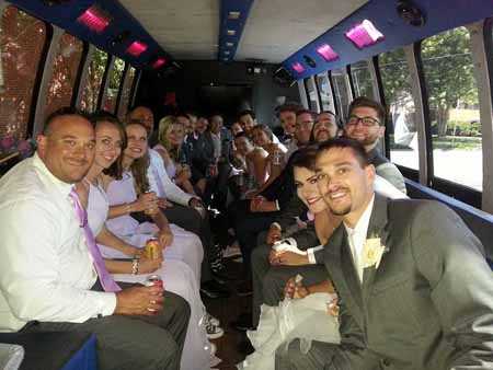 St. Charles wedding party chartering the party limo bus.