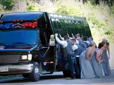 taking wedding pictures with the limo bus