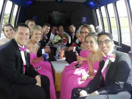 Heading to the wedding reception on the chartered limo bus.